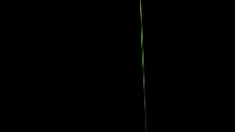 Green liquid rains on black background Video stock 75445868