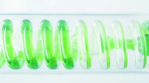 Green liquid in a spiral flask. Stock Footage 242803899