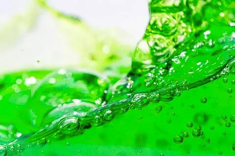 Green liquid splash with bubbles in motion Stock Photos