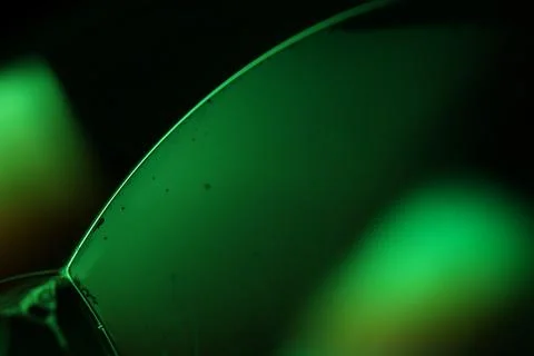 Green liquid surface, phenomenal structure, dark film Stock Photos