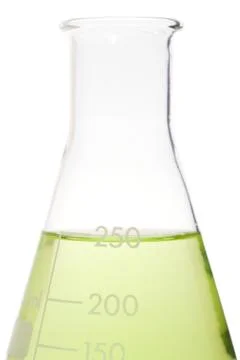 Green liquid in a volumetric flask Stock Photos