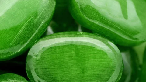Green lollipops, rotation in circle. Seamless loop. Stock Footage 245695317
