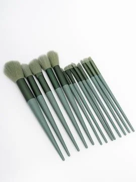 Green makeup brush set close up bristles Stock Photos
