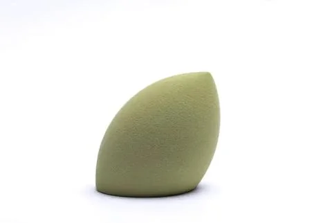 Green makeup sponge with rounded shape on white background Stock Photos