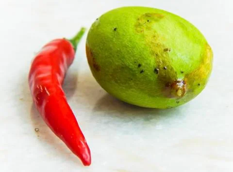 Green mango and red chilli Stock Photos