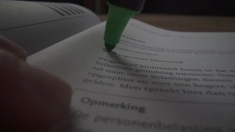 Green marker going trough education book in slowmotion Stock Footage 124015211
