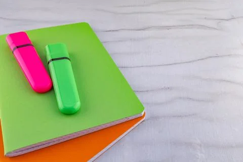 A green marker for marking text placed in the notebook Stock Photos