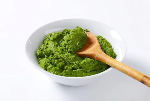 Green matcha or spinach paste in white bowl 写真素材