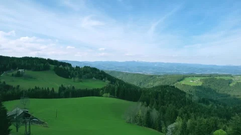 Green meadows in the Alpine mountains in Austria Stock Footage 240859660
