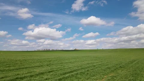 Green Meadows And Cloudy Blue Sky Stock Footage 330335385