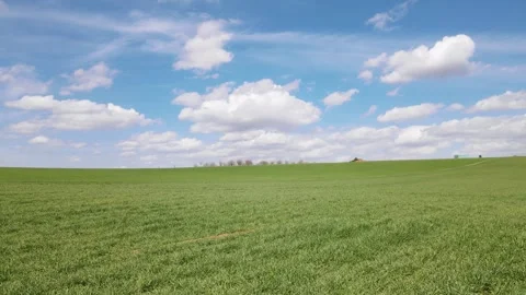 Green Meadows And Cloudy Blue Sky Stock Footage 332151455
