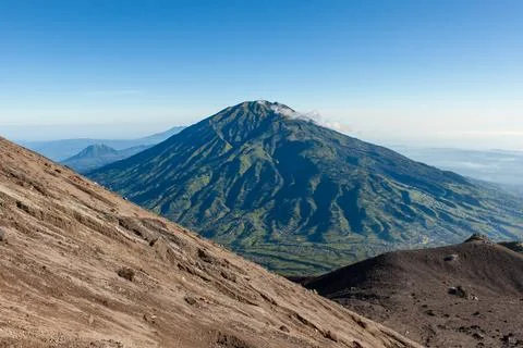 Green Merbabu mountain from Merapi mountain slope at Java island in Indonesia Stock Illustration