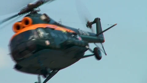 Green MI-8 helicopter performs fighting turn. Close-up. Stock Footage 106491780