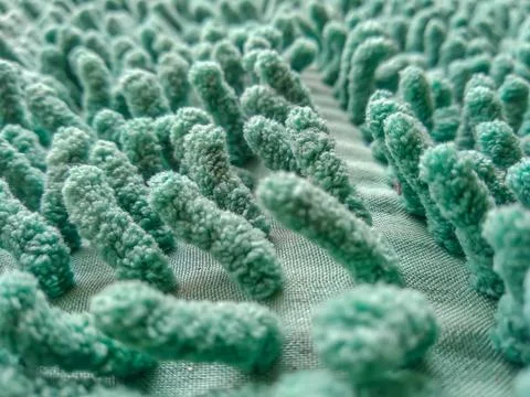 Green microfiber chenille doormat texture full-frame background Foto stock