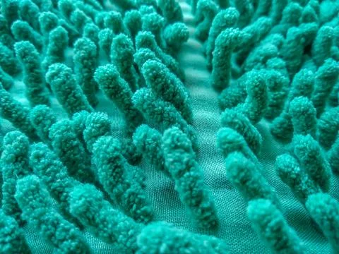Green microfiber chenille doormat texture full-frame background Stock Photos
