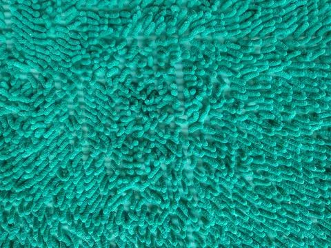 Green microfiber chenille doormat texture full-frame background Foto stock