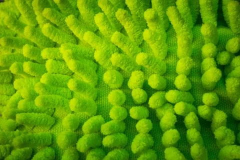 Green microfiber dust mop texture, background. Stock Photos