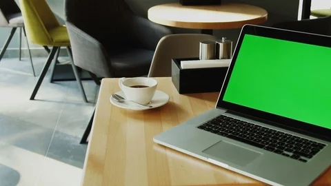 Green mock up screen of personal computer in loft interior cafe with camera Stock Footage 112993056