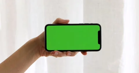 Green Mock-up Screen Smartphone in Horizontal Landscape Mode Stock Footage 130886299
