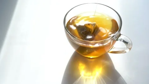 Green Morning Tea. Tea Triangle Bag in a Teacup. Brew Green Tea in a Mug. Close Stock Footage 152530189