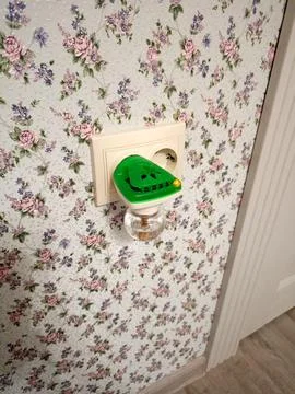 A green mosquito repellent in a socket -  vertical Stock Photos
