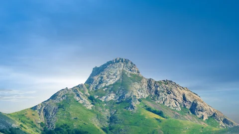 Green mount peak on a sunset background Stock Footage 329180091