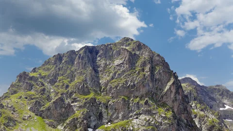 Green mount top on cloudy sky background Stock Footage 178929350