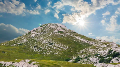 Green mount top under a sparkle sun Stock Footage 247170099