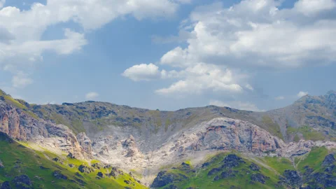Green mountain backbone on a cloudy sky background Stock Footage 340320086