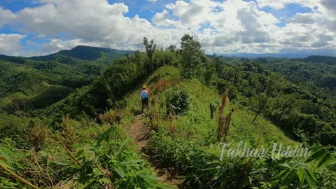 Green Mountain with blue sky and white clouds  Stock Footage 273633925