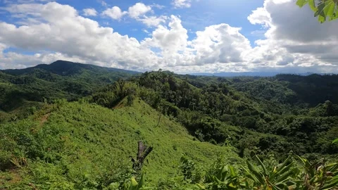 Green Mountain with blue sky and white clouds  Stock Footage 273635879