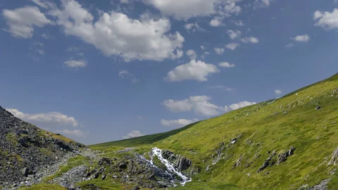 Green mountain pass time lapse scene Stock Footage 177352870