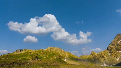 Green mountain ridge on cloudy sky background Stock-Footage 327797859