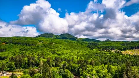 Green Mountain Side With Clouds Stock Photos