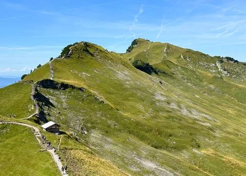 Green mountain with trail Stock Photos