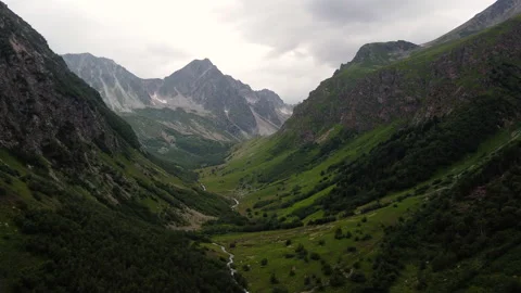 Green mountain valley in cloudy day Stock Footage 231989642