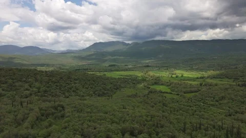 Green Mountain Valley With Dramatic Clouds in Peloponnese Stock Footage 337088667