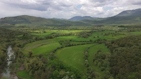Green Mountain Valley With Fields and Clouds in Greece Stock Footage 337165343