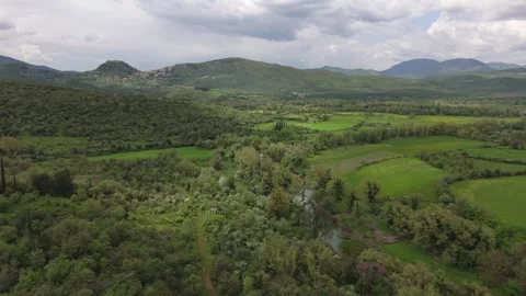 Green Mountain Valley With River and Dramatic Clouds in Greece Stock Footage 337164490