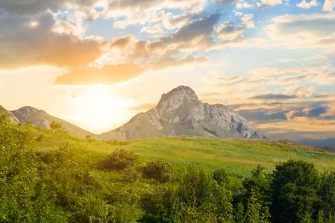 Green mountain valley at the sunset Stock Photos