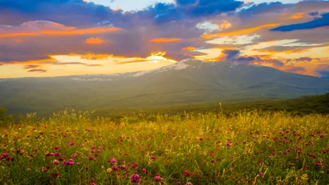 Green mountain valley at the sunset time lapse scene Stock Footage 250153845