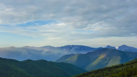 Green mountain valley under blue cloudy sky Stock Footage 342101866