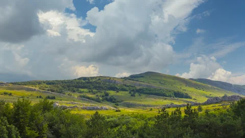Green mountain valley under dense cloudy sky Stock Footage 317175447