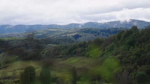 Green mountains and cloudy sky Stock Footage 145360369