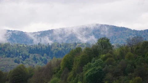 Green mountains and cloudy sky Stock Footage 145360539