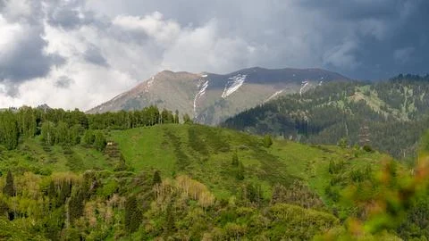 Green Mountains and Dramatic Sky in the Ile-Alatau Range Stock Photos