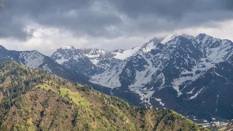 Green Mountains and Dramatic Sky in the Ile-Alatau Range Stock Photos