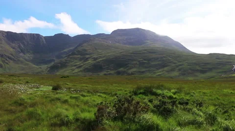 Green Mountains and Grass Fields Blowing in Wind in Ireland Wide Stock Footage 67547829