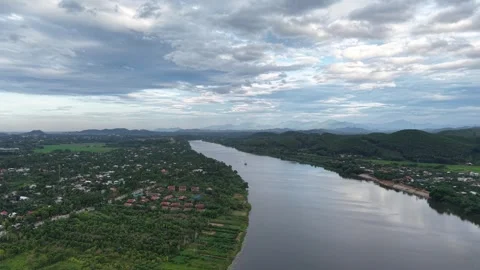 Green mountains and river bend near Hue at golden hour 4K Stock Footage 339863484