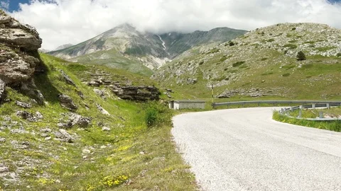 Green mountains and a road in summer in Italy, 4K 스톡 동영상 77040771